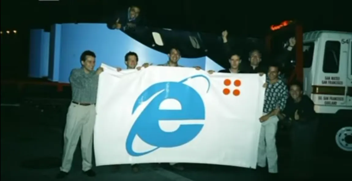 [Giant IE logo is placed in front of Netscape office upon IE 4.0 launch.]