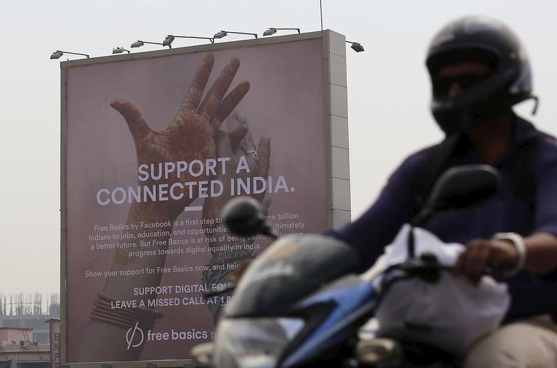 [A billboard advert for Facebook’s Free Basics initiative in Mumbai.]